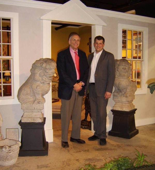 Sam & Jason Hackler in the front plaza at New Hampshire Antique Co-op, flanked by two foo dog statues