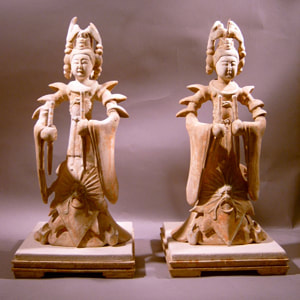 Pair of chinese ming style tomb figurines in clay of a man and woman.